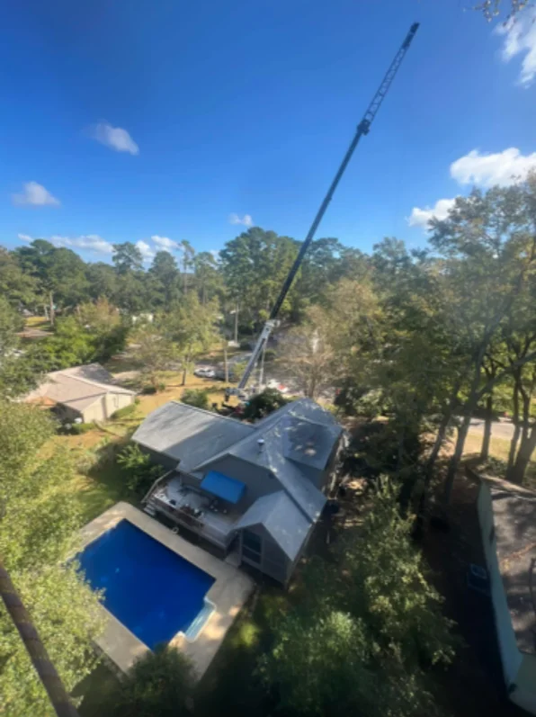 Tree service crew removing a large oak tree in Melbourne, Florida